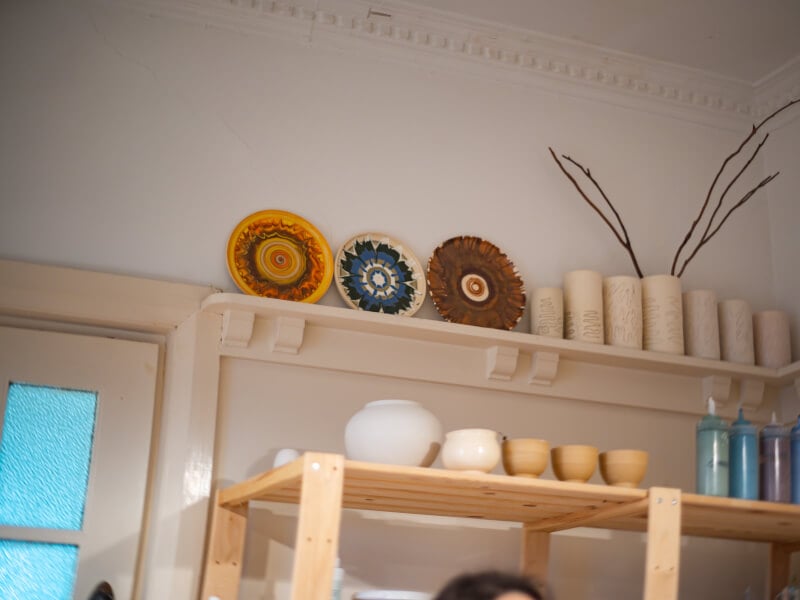A wall of painted ceramics